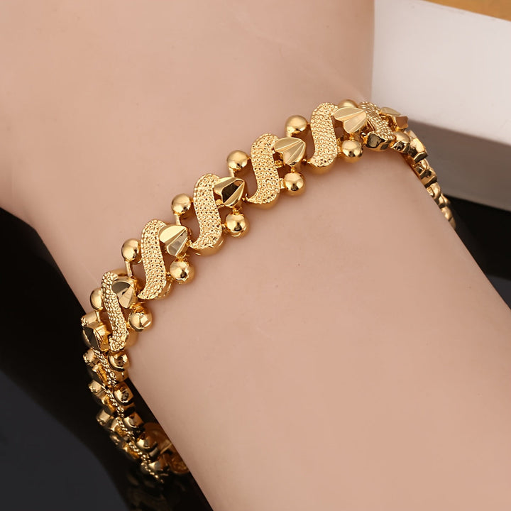 Lily Ornate Wave Bracelet | Guld