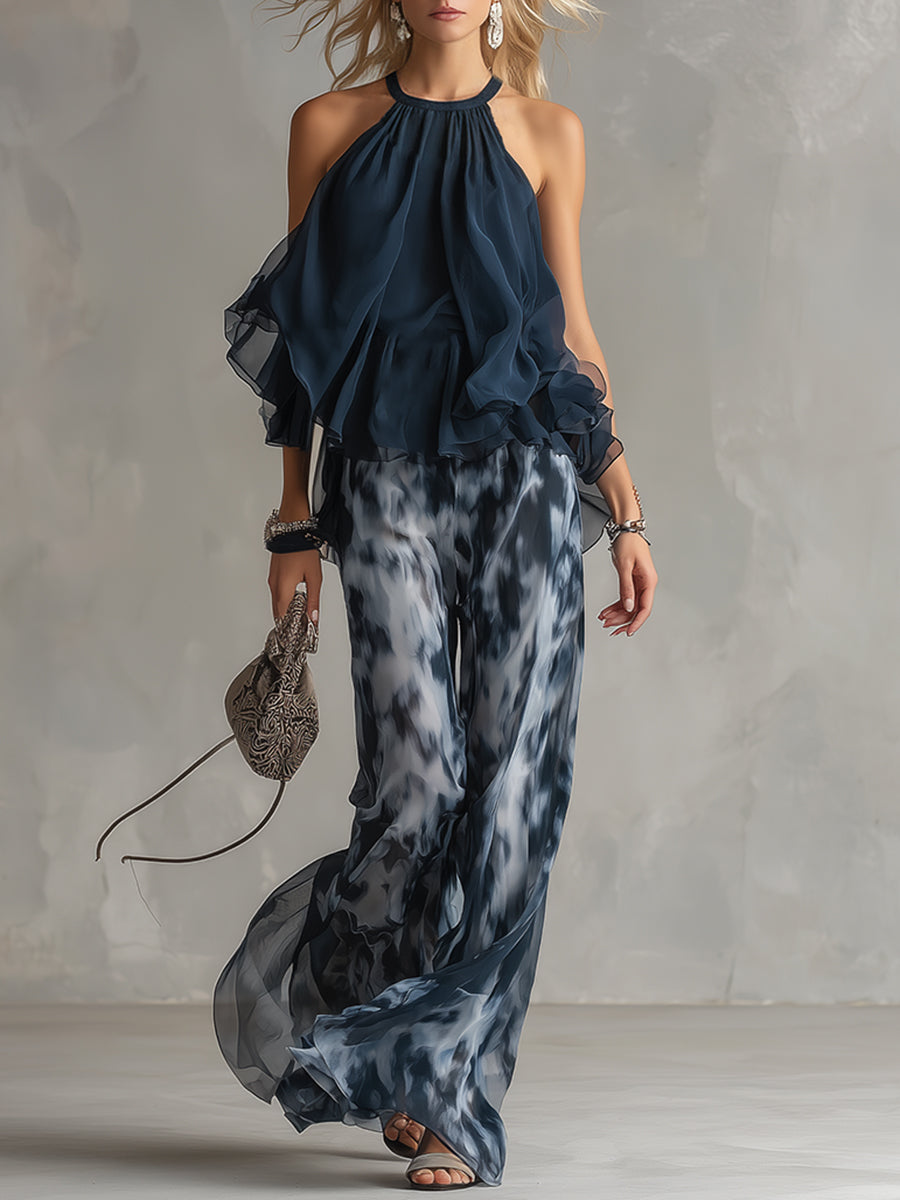 Chloé | Elegant set med marinblå halterneck och vida byxor med mönster